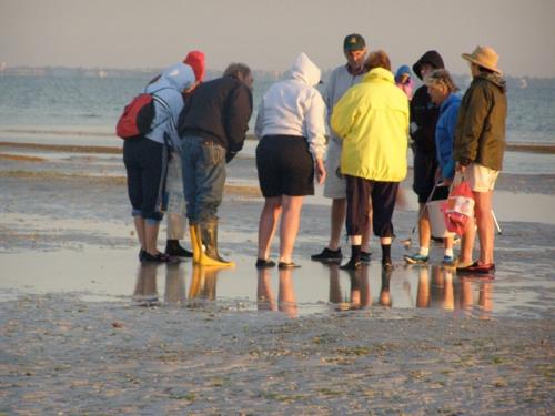 Gathering around Debbie for identification help. - Slide 8